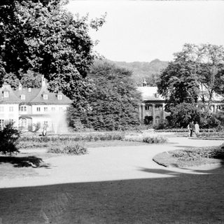Elegant historic estate with manicured gardens.