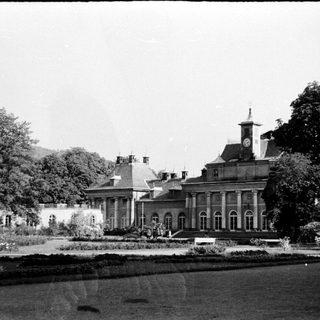 Elegant classical mansion with formal gardens.