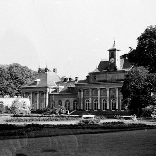 Elegant classical mansion with formal gardens.
