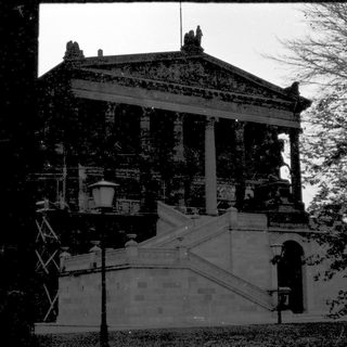 Neoclassical building with columns and stairs.