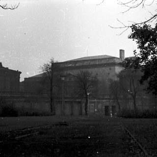 Neoclassical building in park-like setting.