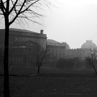 Historic building in misty, overcast urban setting.