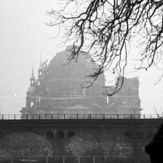 Historic building partially obscured by fog.