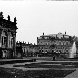 Baroque palace with grand fountain courtyard.