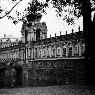 Baroque palace with bridge and canal.