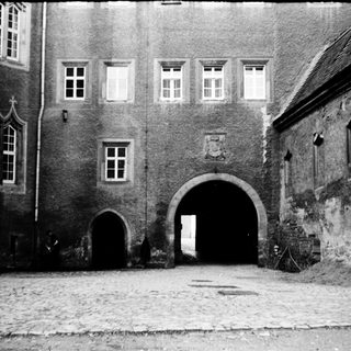 Historic stone gateway in courtyard.