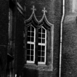 Historic stone gateway in courtyard.