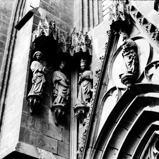 Gothic stone statues on cathedral facade.