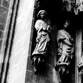 Gothic stone statues on cathedral facade.