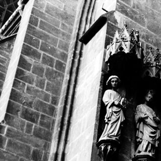 Gothic stone statues on cathedral facade.