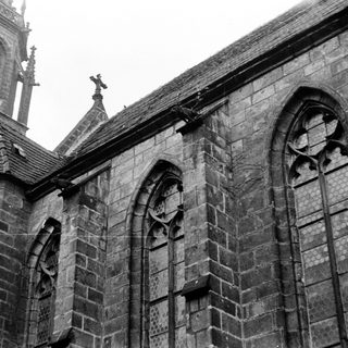 Gothic stone church facade with pointed arches.