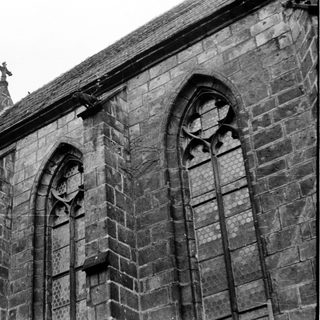 Gothic stone church facade with pointed arches.
