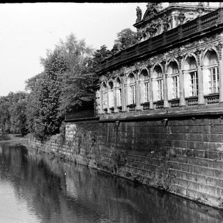Historic building along a calm canal.