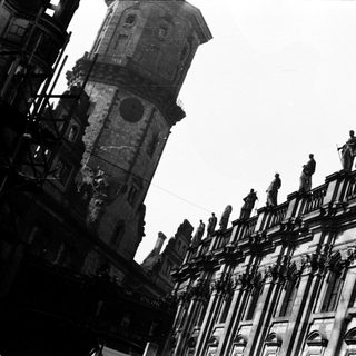 Historic European architecture with ornate towers and statues.