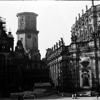 Historic European plaza with grand baroque architecture.