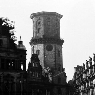 Historic European plaza with grand baroque architecture.