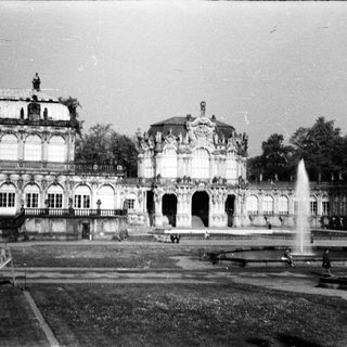 Baroque palace gardens with ornate fountains and classical architecture.