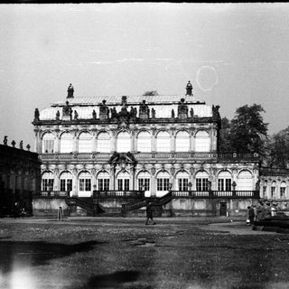 Baroque palace with ornate facade and statues.