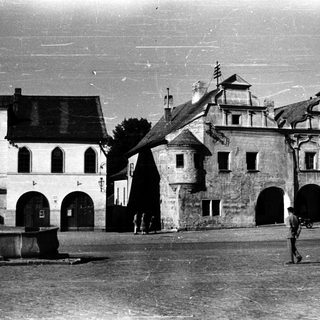 Historic European town square with old architecture.