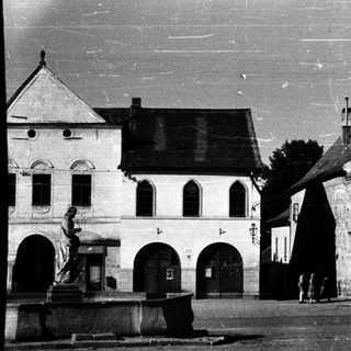 Historic European town square with old architecture.