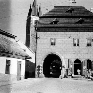Historic town gatehouse with arched entrance.