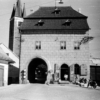 Historic town gatehouse with arched entrance.