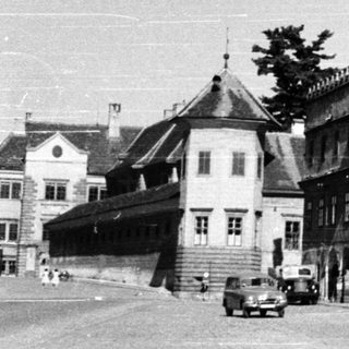 Historic European street with medieval-style buildings.