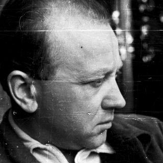 Close-up portrait of balding man in profile.