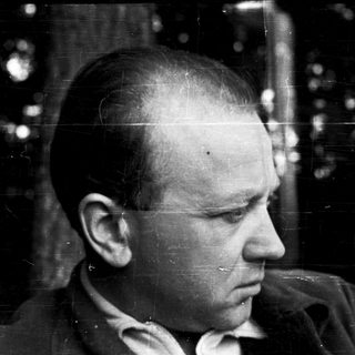 Close-up portrait of balding man in profile.