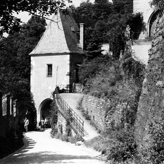Historic stone gatehouse with arched entrance.