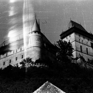 Historic castle with tall towers and fortified walls.