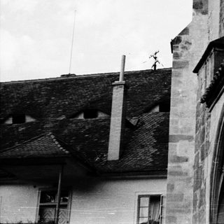 Gothic stone carving on historic building facade.