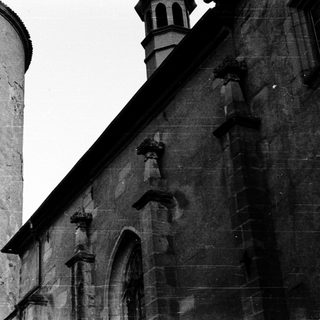 Historic stone tower and church facade.