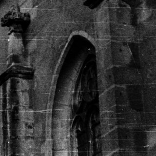 Historic stone tower and church facade.