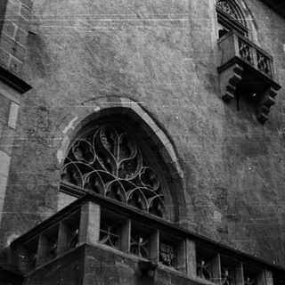 Gothic stone arch window with tracery.