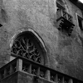 Gothic stone arch window with tracery.
