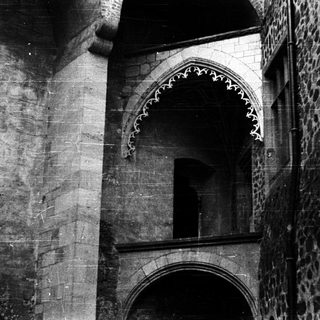 Gothic stone archway with intricate tracery.