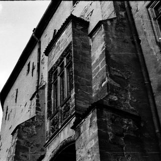 Gothic-style stone building with weathered facade.