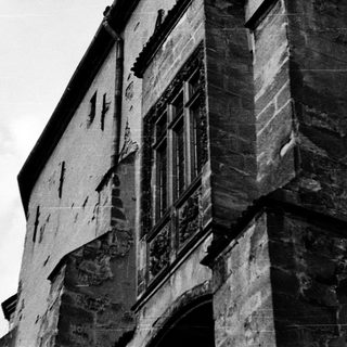 Gothic-style stone building with weathered facade.