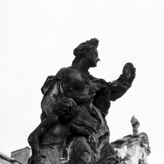 Equestrian statue of a draped historical figure.