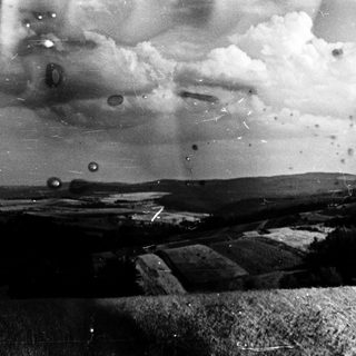 Aerial view of rural landscape with clouds.