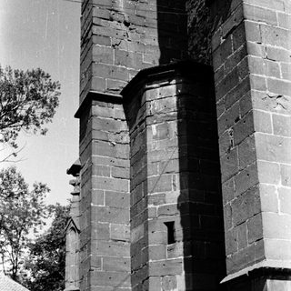 Historic brick tower with weathered architectural details.