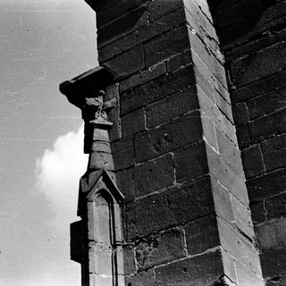 Gothic stone tower with pointed arch detail.