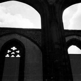 Architectural arches with illuminated star pattern.
