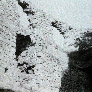 Stone ruins of ancient stone wall.
