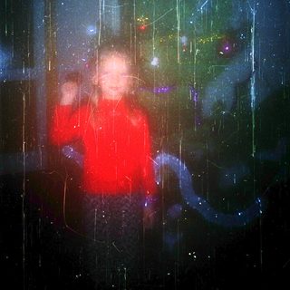 Silhouette in rain under illuminated night sky.