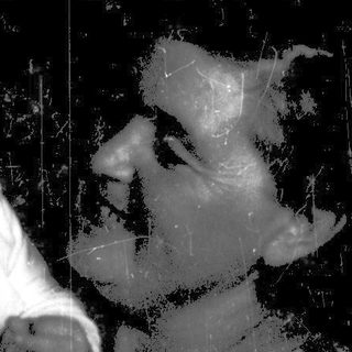 A baby and adult in vintage-style photo, holding hands through a reflective surface.