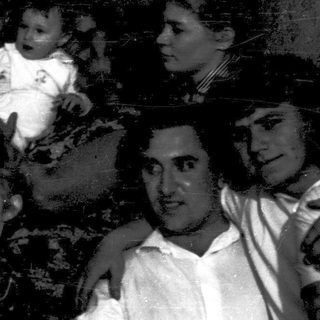 Family group portrait from early 20th century.