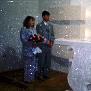 Wedding ceremony with vows exchange at altar.
