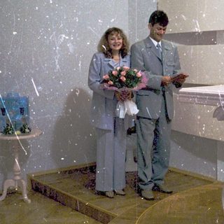 Couple exchanging wedding vows at a modern ceremony.